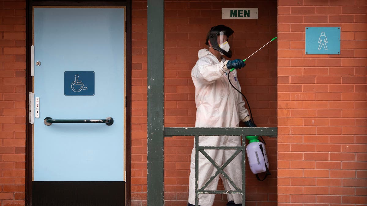 A man disinfects public toilets in Leicester on Monday. (AP/PA)