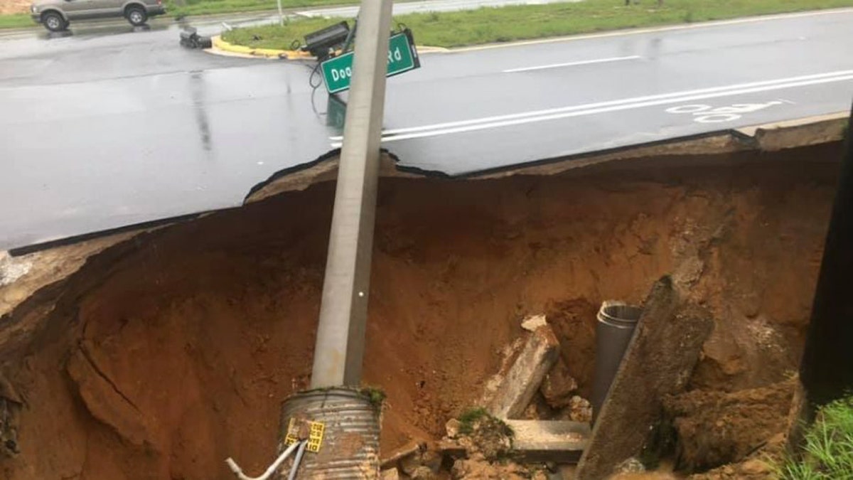 A sinkhole opened up along a roadway in Marion County, Florida, on Sunday, causing a crash.