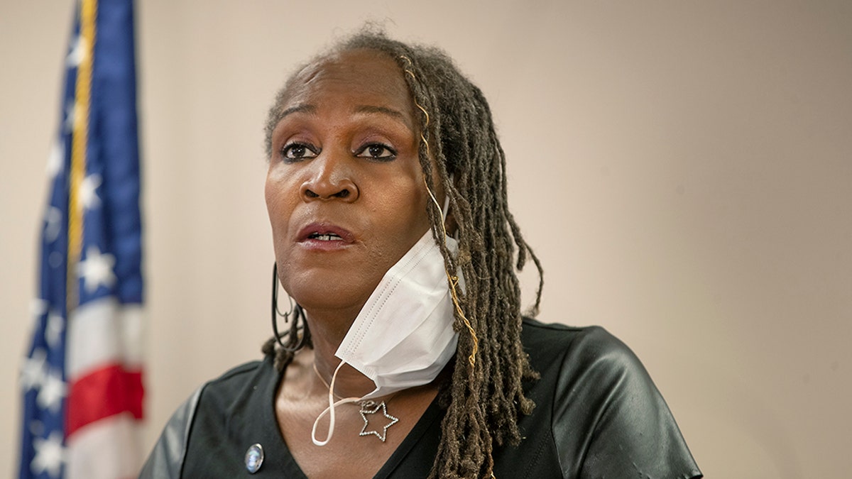 City Council Vice President Andrea Jenkins sings Amazing Grace during a news conference Thursday, May 28, 2020 in Minneapolis, Minn. Violent protests over the death of a black man in police custody rocked a Minneapolis neighborhood for a second straight night as angry crowds looted stores, set fires and left a path of damage that stretched for miles. The mayor asked the governor to activate the National Guard. (Elizabeth Flores/Star Tribune via AP)