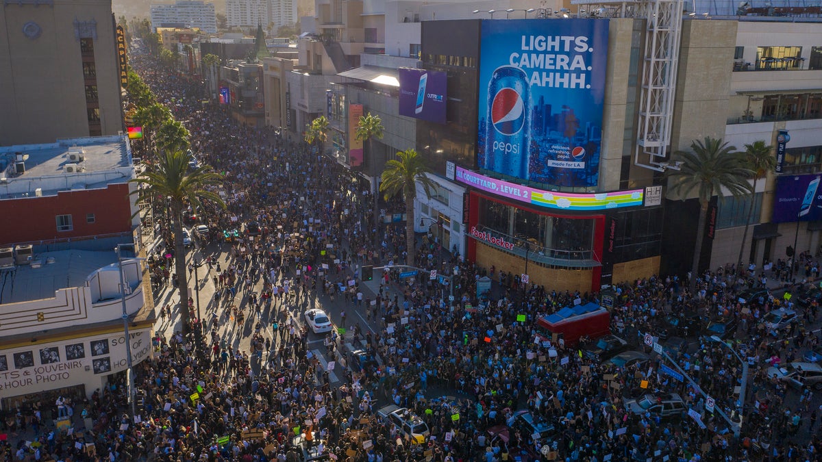 Protesters congregate at the Hollywood and Highland intersection as demonstrations continue over the killing of George Floyd despite the dangers of the widening coronavirus (COVID-19) pandemic on June 7, 2020 in the Hollywood section of Los Angeles, California.