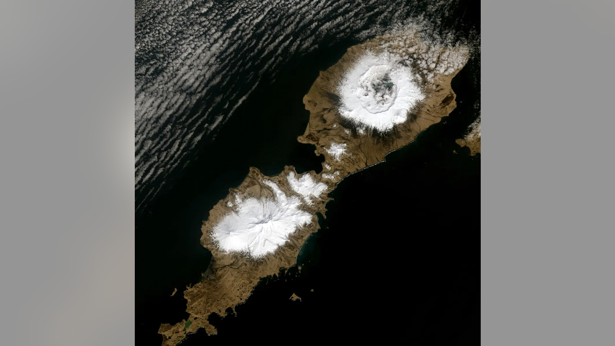 Alaska’s Umnak Island in the Aleutians showing the huge, 10-km wide caldera (upper right) largely created by the 43 BCE Okmok II eruption at the dawn of the Roman Empire. Landsat-8 Operational Land Imager image from May 3, 2014. Credit: U.S. Geological Survey.