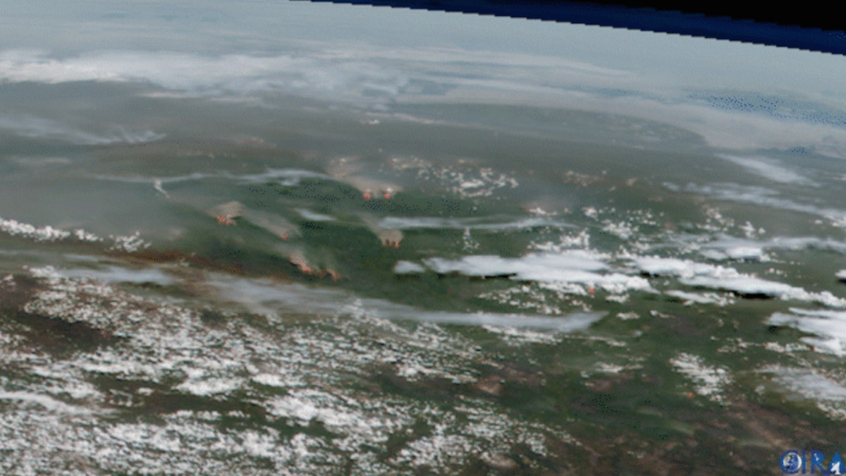 Smoke and flames from active fires burning across Sibera can be seen on this satellite imagery from June 21.