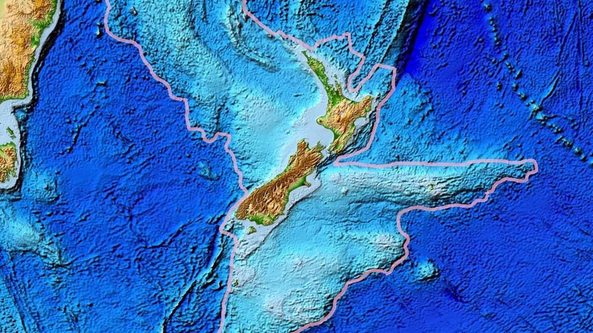 A map of Zealandia, outlined in gray, is seen above.