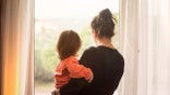 Mom holding child