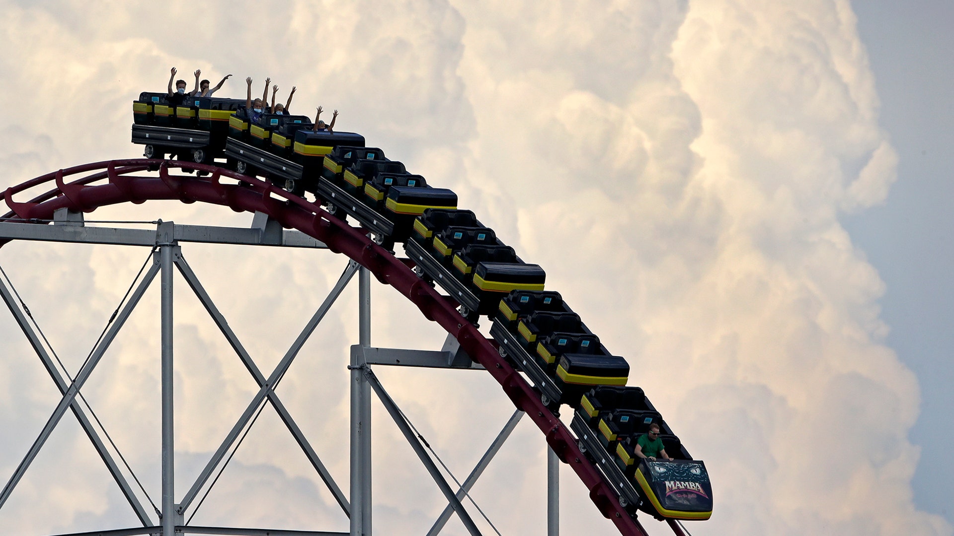 People maintain social distance as they ride a roller coaster at the Worlds of Fun amusement park in Kansas City, Missouri, June 22, 2020. 