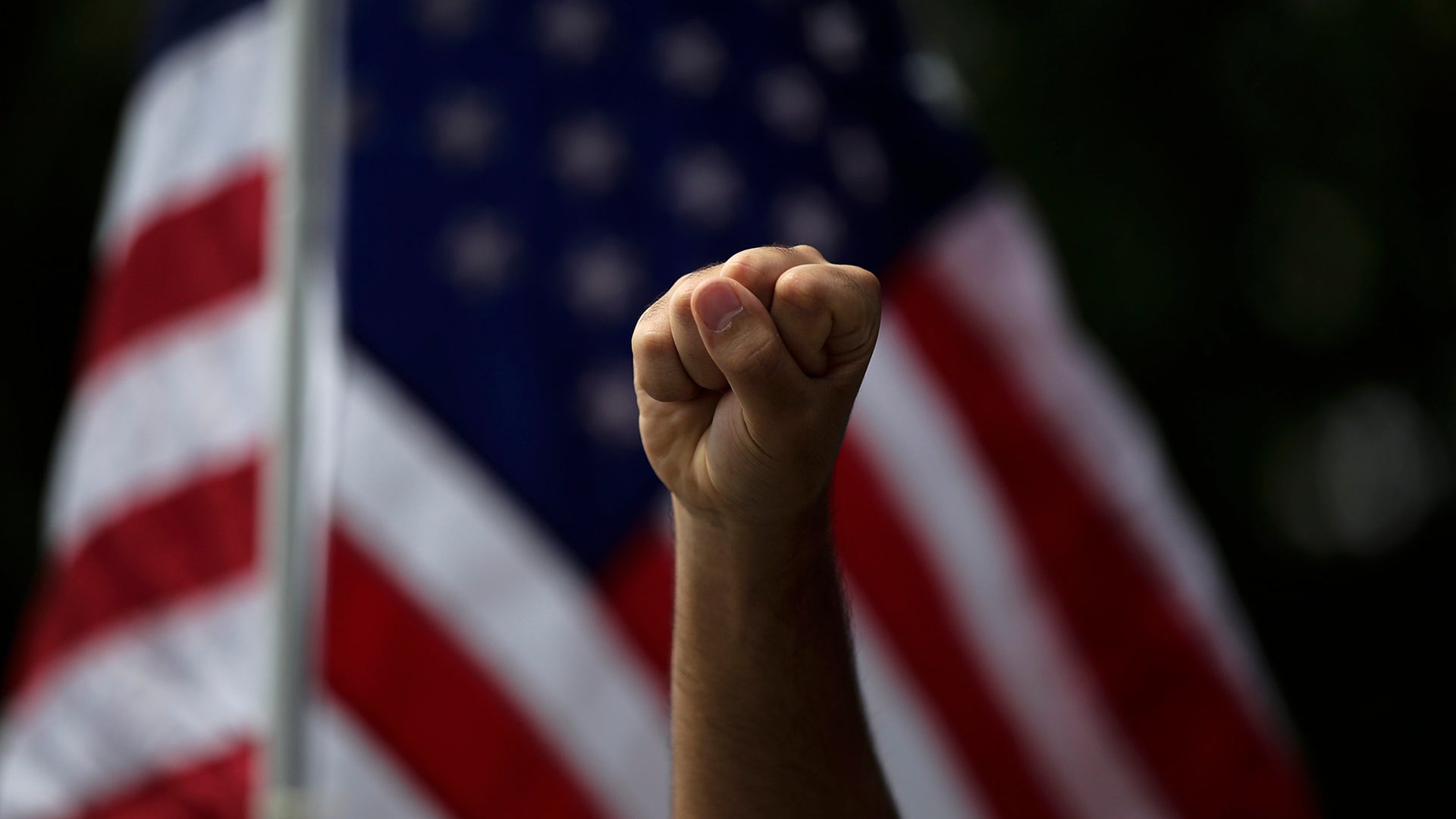 A demonstrator raises his fist during a protest over the death of George Floyd in Anaheim, Calif., June 1, 2020.