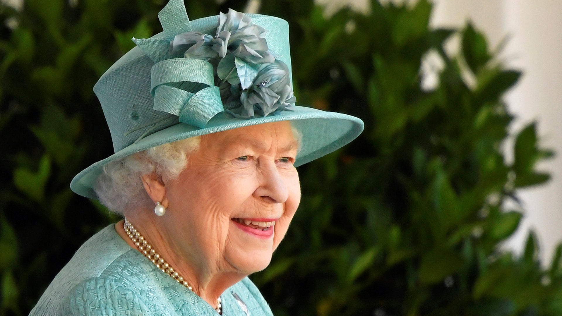 Britain's Queen Elizabeth II reacts as she looks out during a ceremony to mark her official birthday at Windsor Castle in Windsor, England, June 13, 2020. 