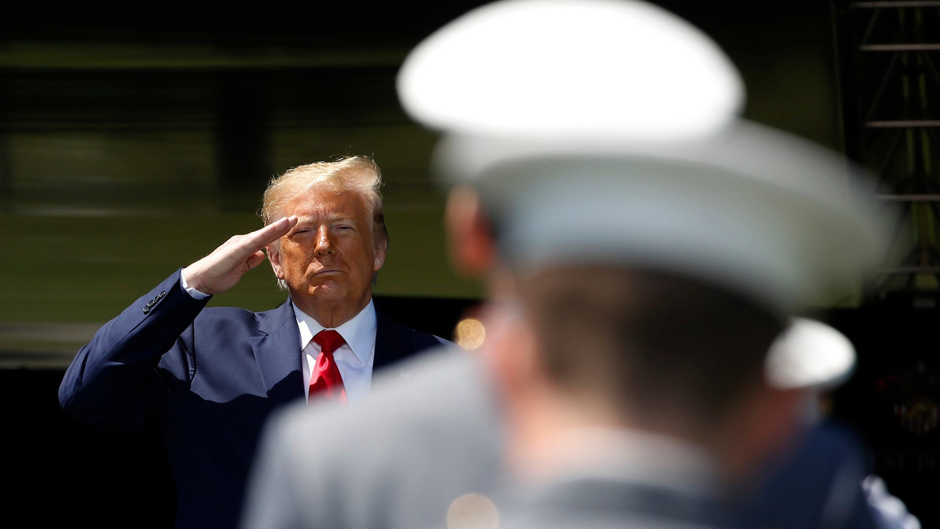 President Donald Trump salutes after speaking to over 1,110 cadets in the Class of 2020 at a commencement ceremony on the parade field, at the United States Military Academy in West Point, New York, June 13, 2020. 