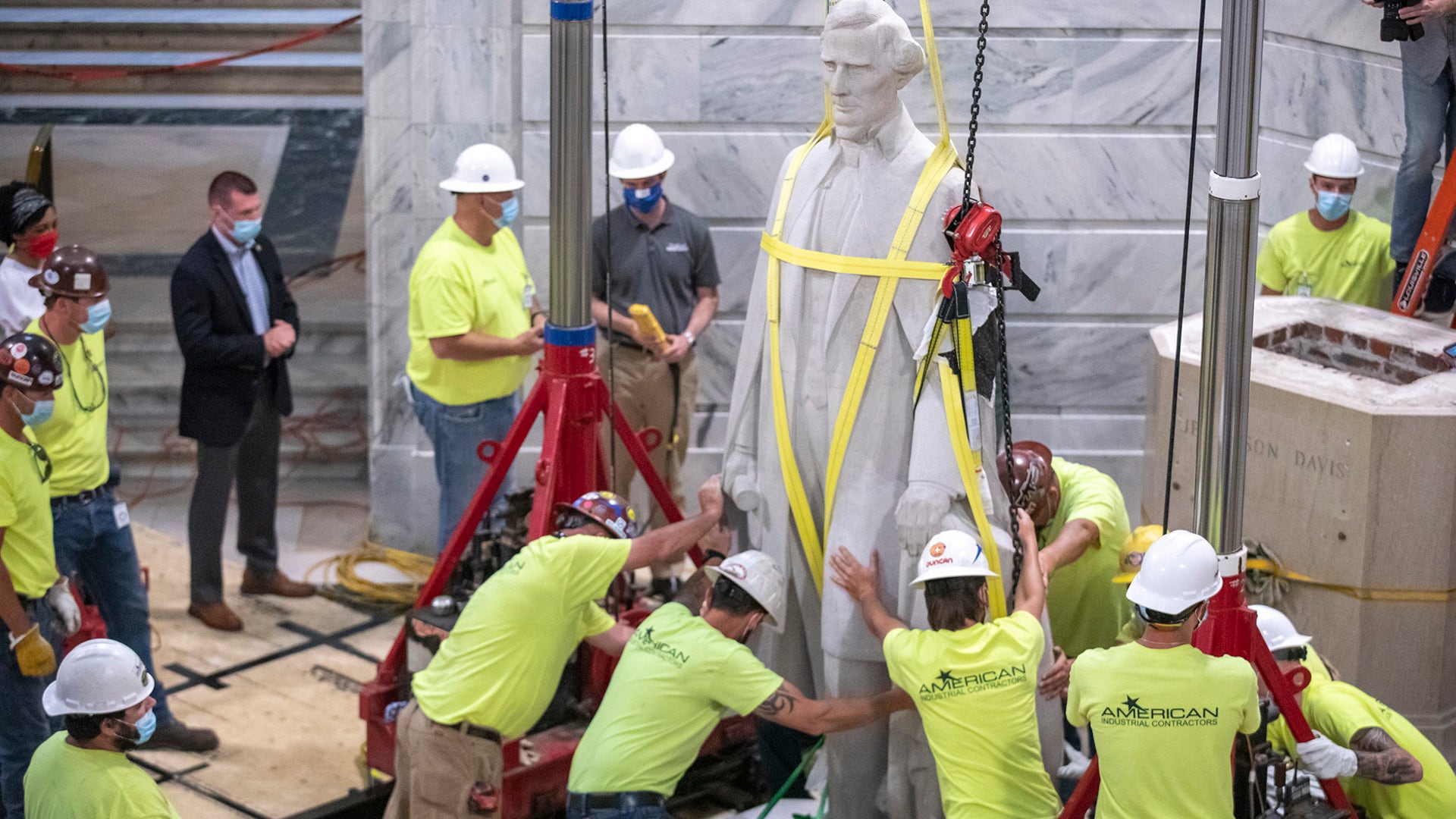 Workers prepare to remove the Jefferson Davis statue from the Kentucky State Capitol in Frankfort, June 13, 2020. 