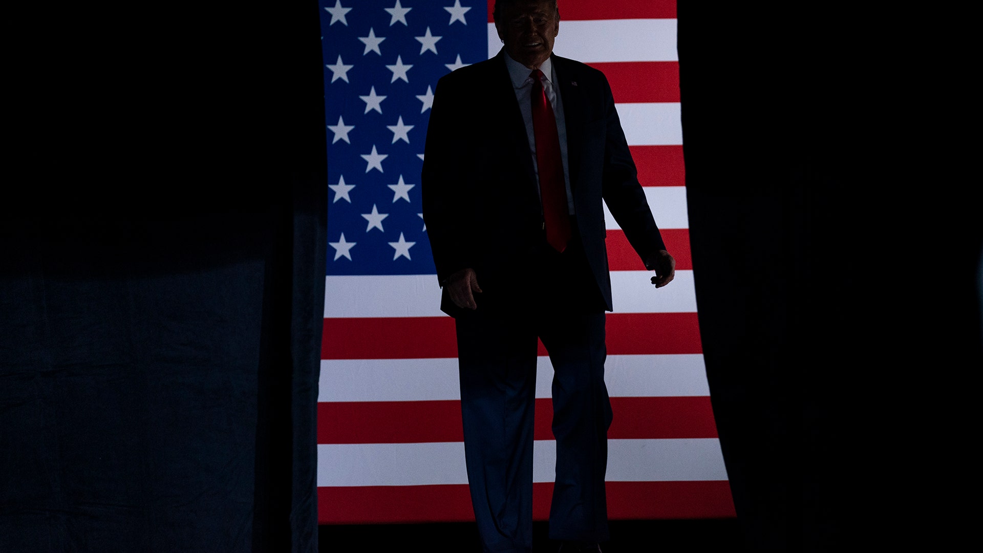 President Donald Trump arrives on stage to speak at a campaign rally at the BOK Center in Tulsa, Oklahoma, June 20, 2020.