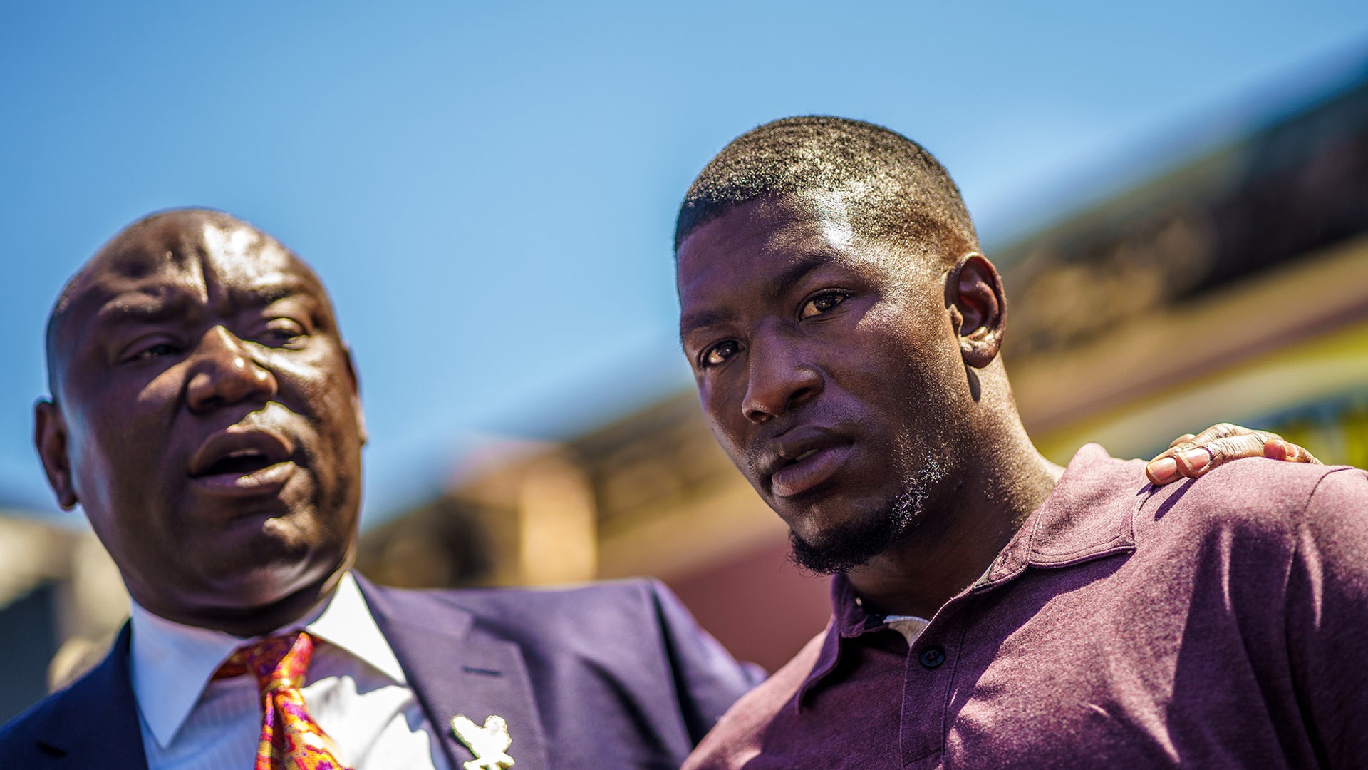 George Floyd's son, Quincy Mason Floyd listens to family Attorney Ben Crump speak to the press, as family members visit the site where George Floyd died in Minneapolis, Minnesota, June 3, 2020.