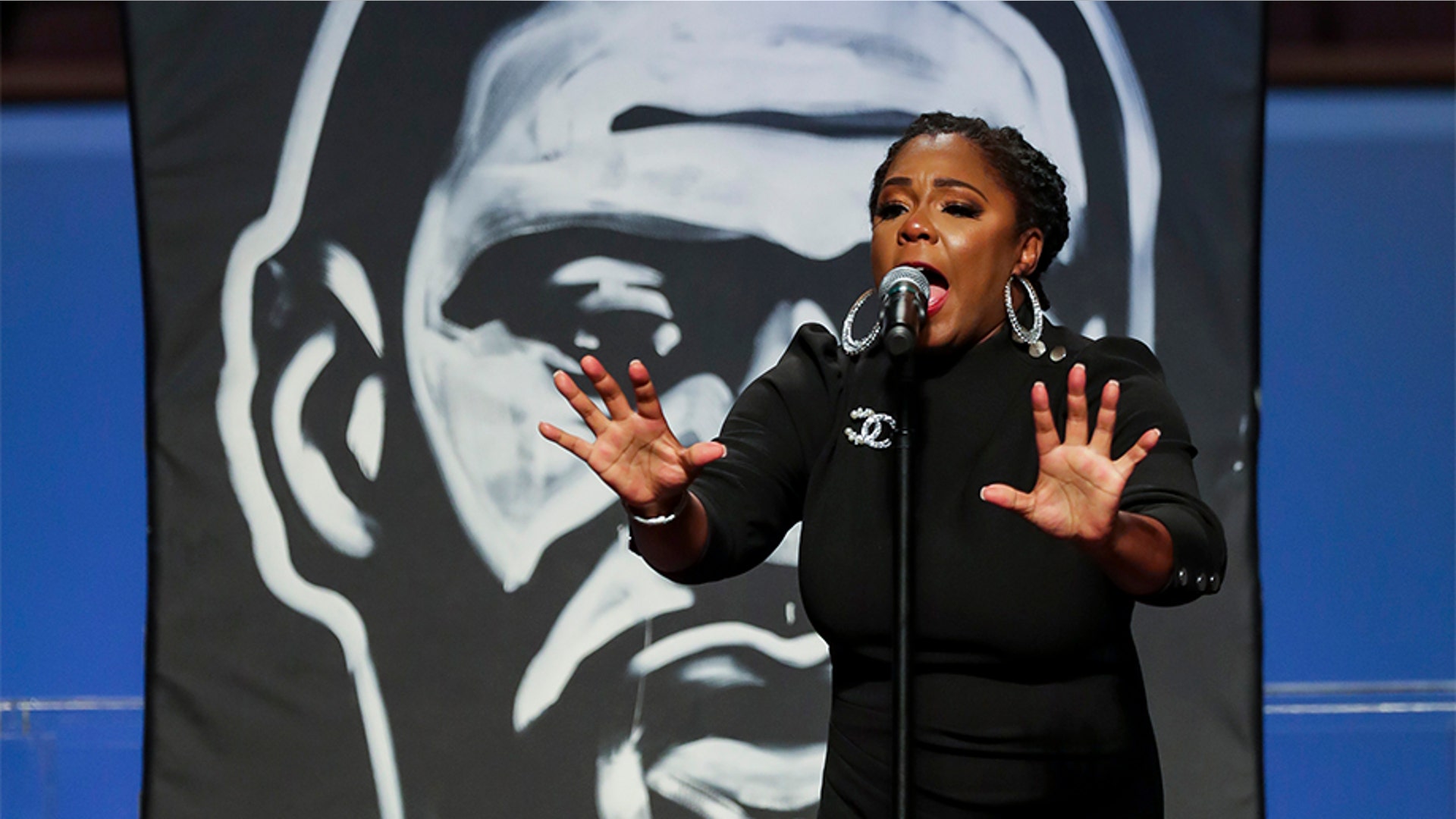 Nakitta Foxx singing at the service.