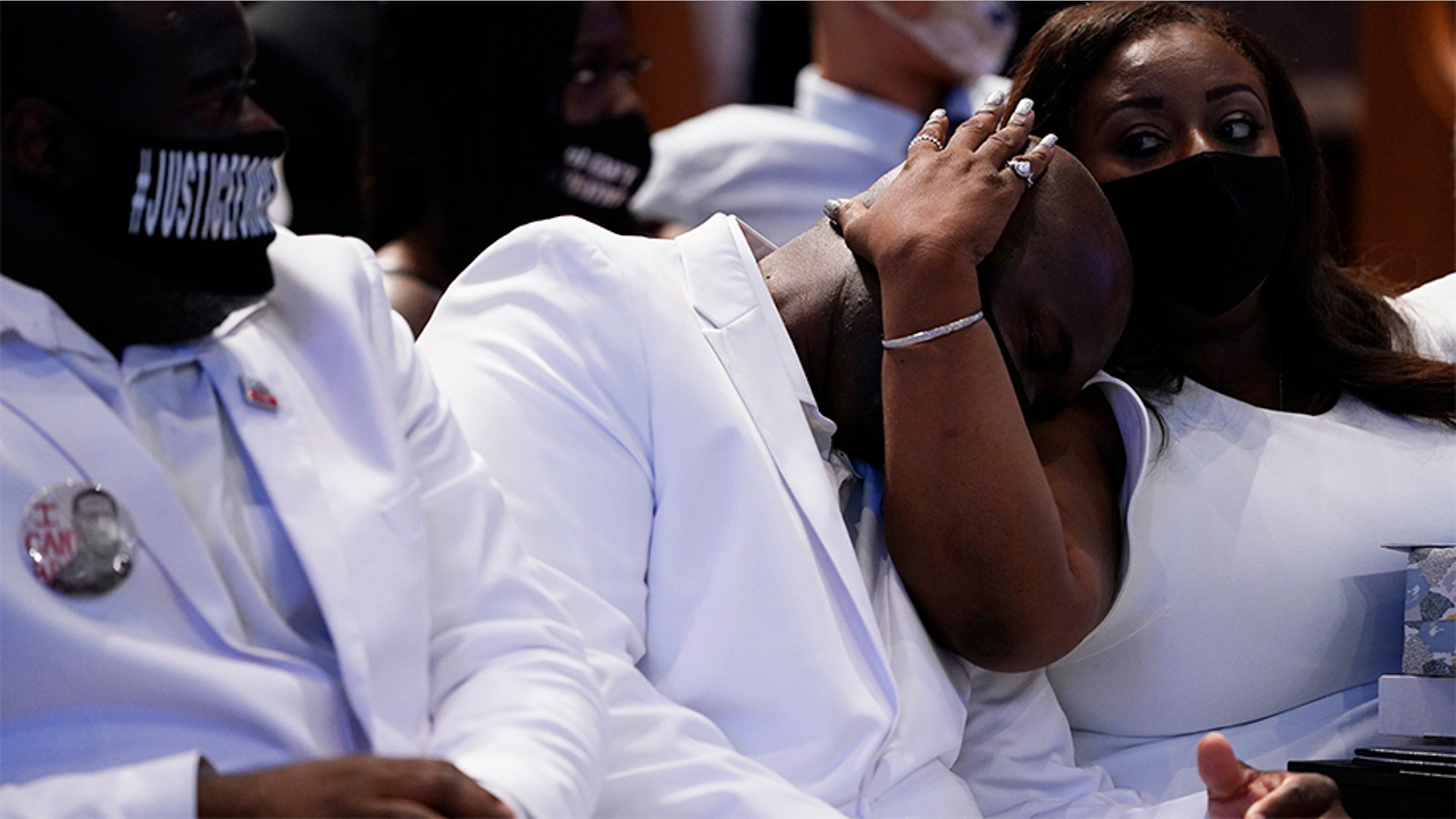 Philonise Floyd, center, being comforted during the funeral service.