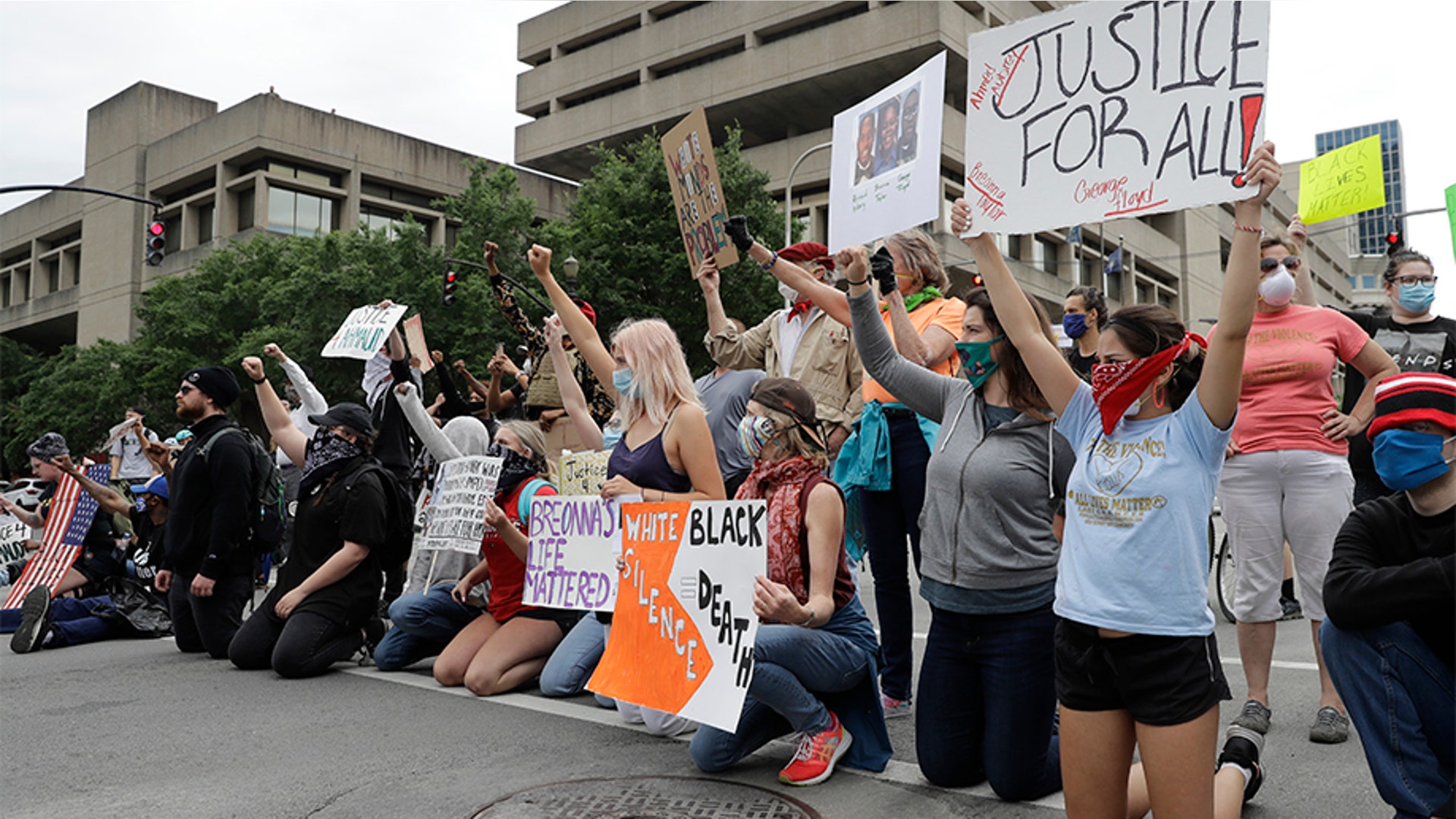 Protesters kneeling in the middle of the street to block traffic as they protest the deaths of George Floyd and Breonna Taylor on May 29 in Louisville, Ky.