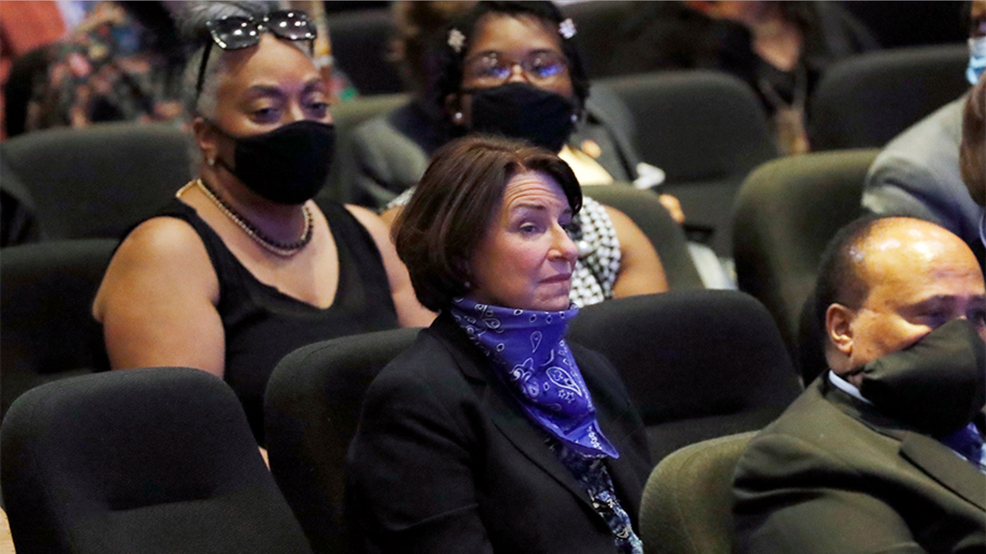 Sen. Amy Klobuchar, D-Minn., center, sitting among guests.