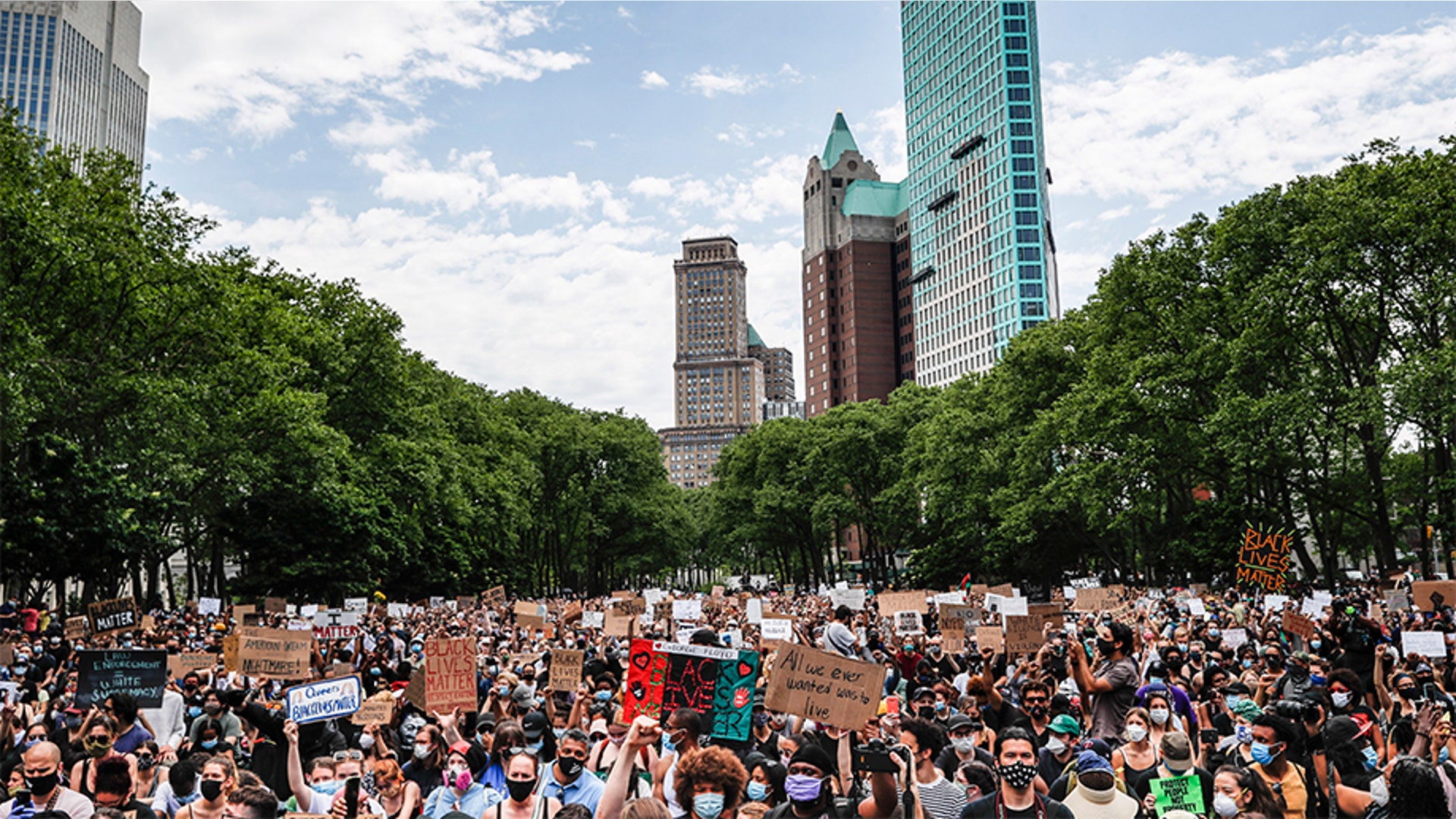 New Yorkers gathering for a memorial service for George Floyd at Cadman Plaza Park in Brooklyn, N.Y.