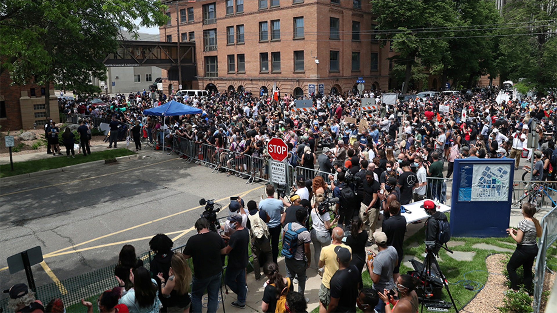 People standing outside during George Floyd's memorial service.