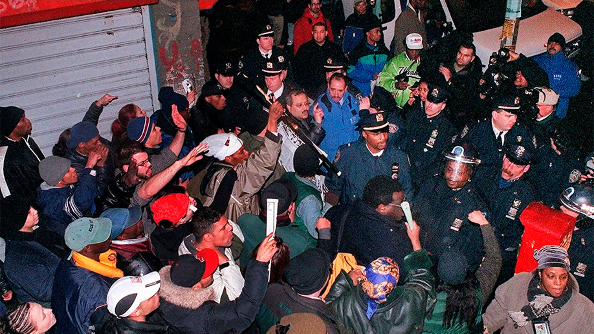 A loud but mostly nonviolent group of demonstrators being stopped by police in the Bronx on Feb. 25, 2000, as they tried to march around the block where Amadou Diallo lived. Four New York City police officers were acquitted earlier Friday of all charges in the shooting death of Diallo in February 1999.