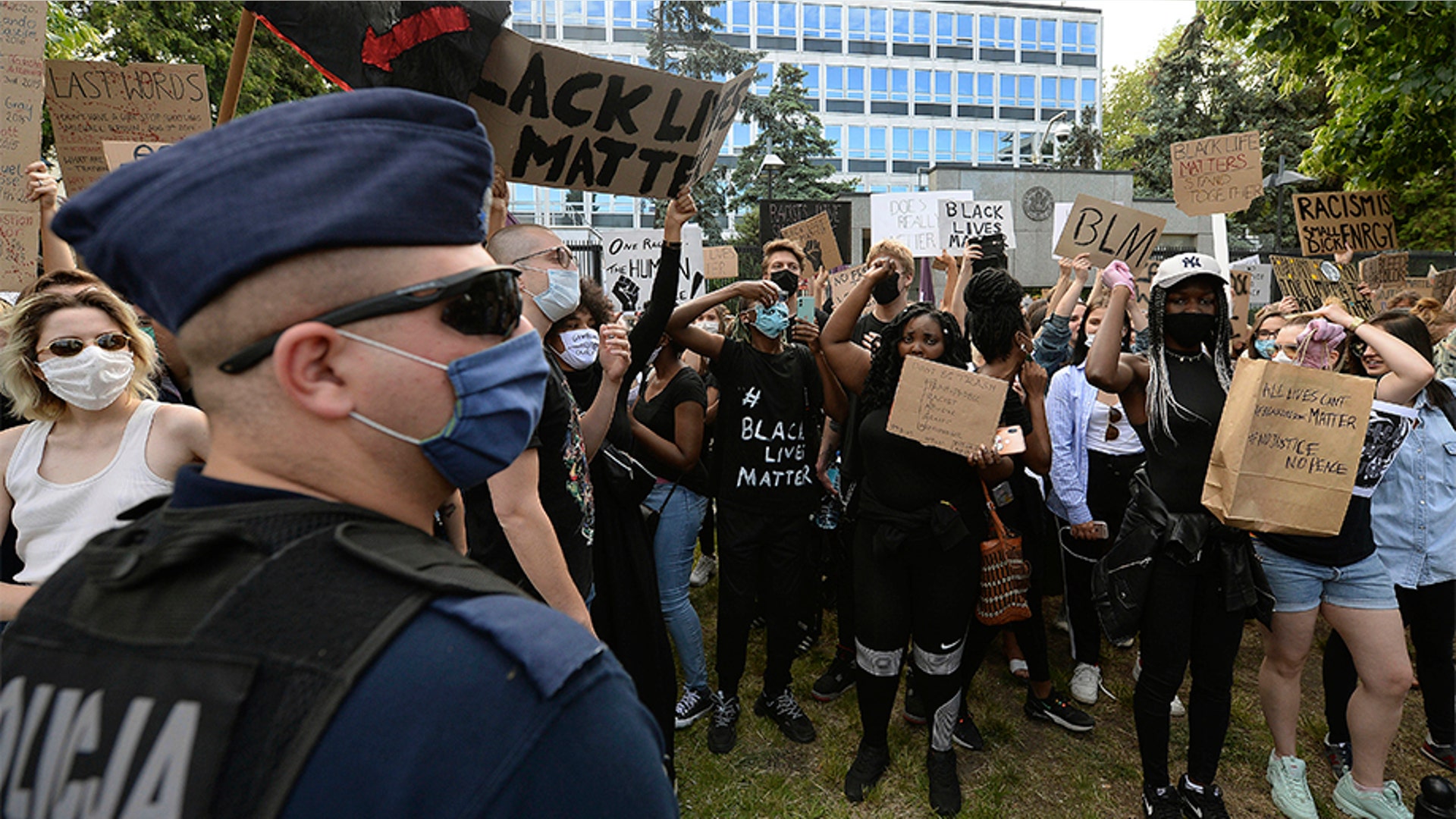 People taking part in an anti-racism protest in front of the U.S. Embassy in Warsaw, Poland.