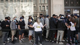 Shoppers pack stores in England as coronavirus restrictions ease