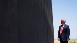 Trump tours border wall as construction hits 200-mile mark