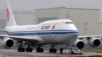 Chinese airlines cut many Beijing flights as coronavirus cases there rise