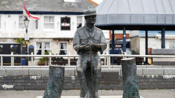 Statue of Scouts founder Robert Baden-Powell given 24-hour guard as removal in UK is delayed