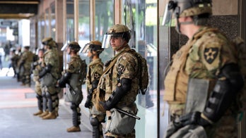 Wisconsin governor activates National Guard after night of violence, 2 statues toppled