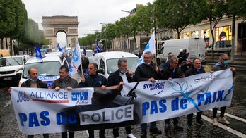 French police throw down handcuffs, 'insulted' after being accused of brutality, racism