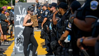 White DC protester seen yelling in faces of black cops in viral video: 'They're a part of the problem'