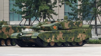 Chinese armored vehicles conduct massive attack drills