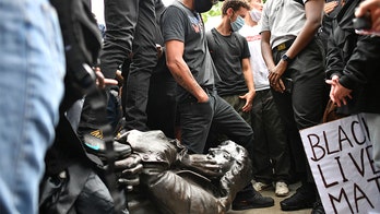 UK crowd tears down statue of 17th-century slave trader Edward Colston, throws it in harbor