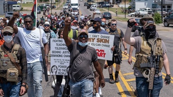 Armed protesters march to Oklahoma governor’s mansion over police killings of black men
