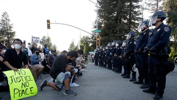 George Floyd unrest: Police out in force in major cities to tamp down on riots as curfews take effect