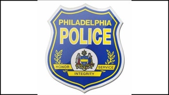 Philadelphia police arrest 2 men suspected of setting cruiser on fire