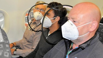 Design firm debuts protective shield for reducing 'droplet transmission' between airline passengers