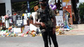 Armed Atlanta protesters near Rayshard Brooks shooting site say police are 'not allowed' in area