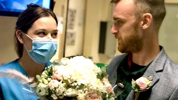 Hospital workers stage makeshift wedding at work on what was supposed to be their big day