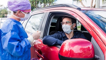 Coronavirus single-day case tally in US tops 50,000 for first time, reports say