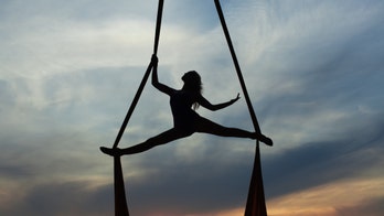Aerial acrobat practices crazy tricks at home during pandemic