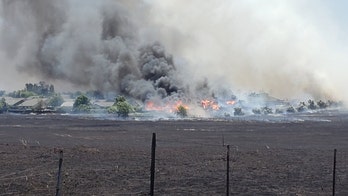 California wildfire destroys several homes as Arizona blaze grows to over 100,000 acres