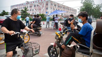 Beijing closes food market, locks down district after new coronavirus outbreak