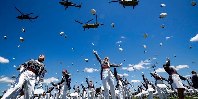 United States Military Academy graduating cadets celebrate at the end of their commencement ceremonies, June 13, 2020, in West Point, New York.