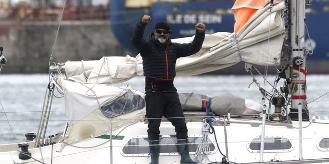 Juan Manuel Ballestero stands on his boat in Mar del Plata, Argentina, Thursday, June 18, 2020. Ballestero crossed the Atlantic on a small sailboat, setting off from the port of Porto Santo in Portugal on March 24 and finally reaching Mar del Plata on Wednesday to be reunited with his parents after flights to Argentina were cut due to the COVID-19 lockdown.