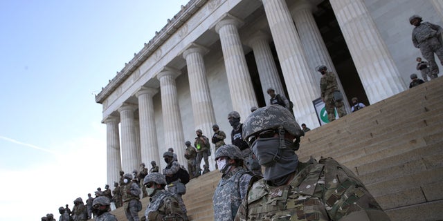 Members of the D.C. National Guard stand on the steps of the Lincoln Memorial as demonstrators participate in a peaceful protest against police brutality and the death of George Floyd, on June 2, 2020 in Washington, DC. Protests continue to be held in cities throughout the country over the death of George Floyd, a black man who was killed in police custody in Minneapolis on May 25.