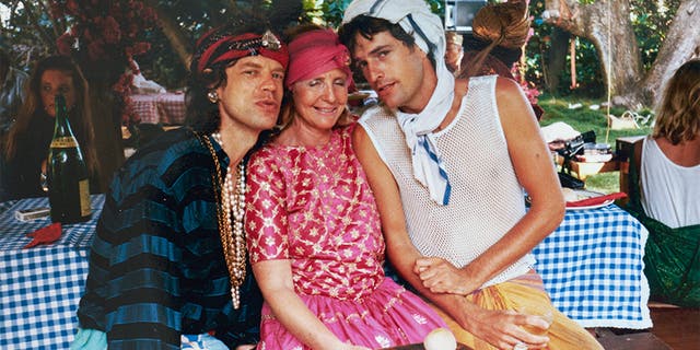 Lady Anne Glenconner (center) with Mick Jagger (left) and Rupert Everett.