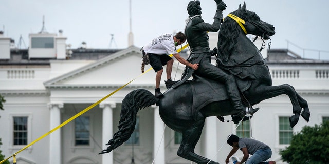WASHINGTON, DC - JUNE 22: Protesters attempt to pull down the statue of Andrew Jackson in Lafayette Square near the White House on June 22, 2020 in Washington, DC. Protests continue around the country over police brutality, racial injustice and the deaths of African Americans while in police custody. (Photo by Drew Angerer/Getty Images)