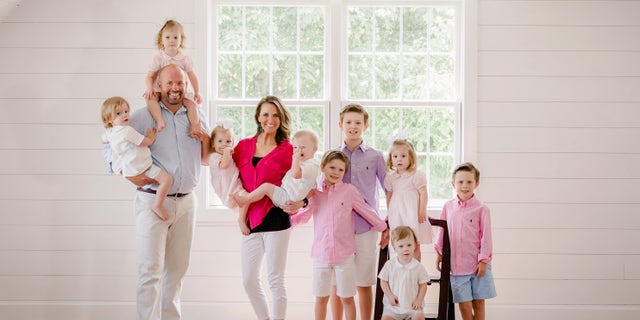 Eric and Courtney with their nine kids.