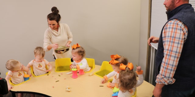Eric (L) and Courtney (R) feeding the six babies.