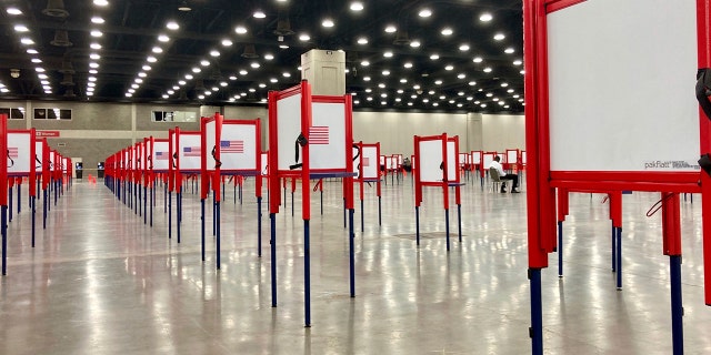 Voting stations are set up for the primary election at the Kentucky Exposition Center, Monday, June 22, 2020, in Louisville, Ky. (AP Photo/Piper Blackburn)